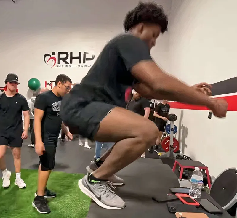 High school aged athletes perform explosive jump training at Rewire Health & Performance in Franklin MA